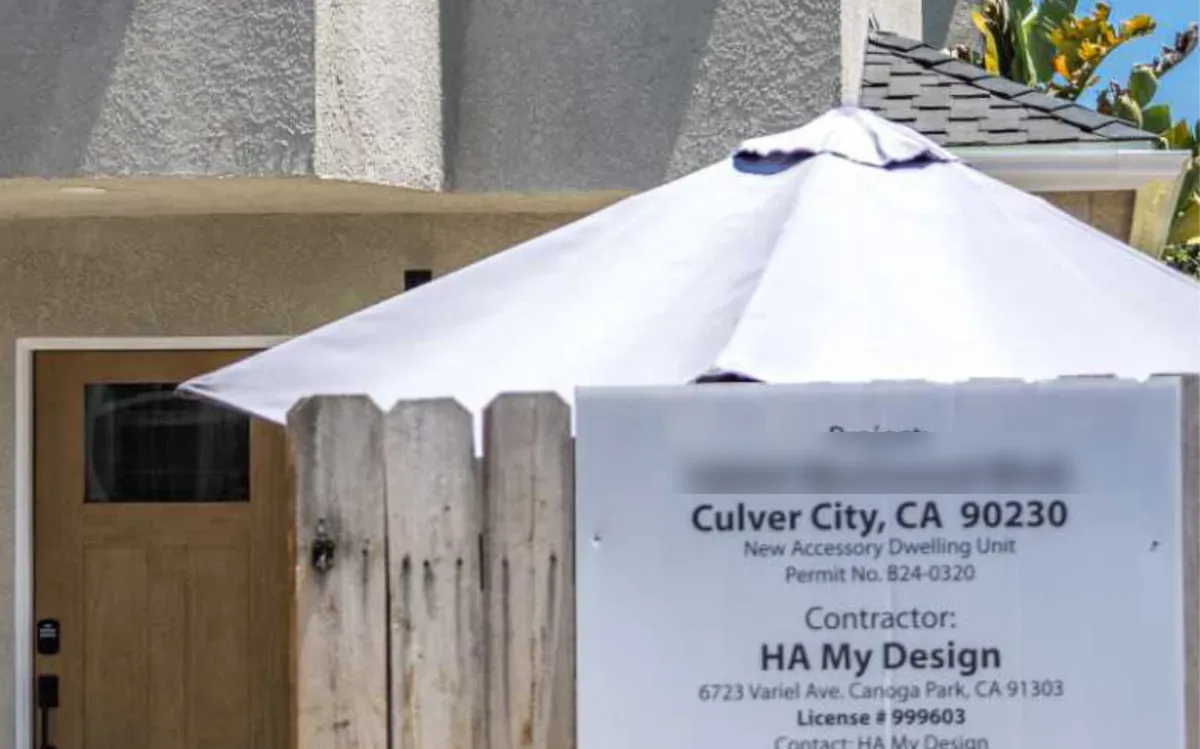 Construction permit board outside an H&A My Design ADU project in Culver City, showing the new accessory dwelling unit permit number and the contractor license number.