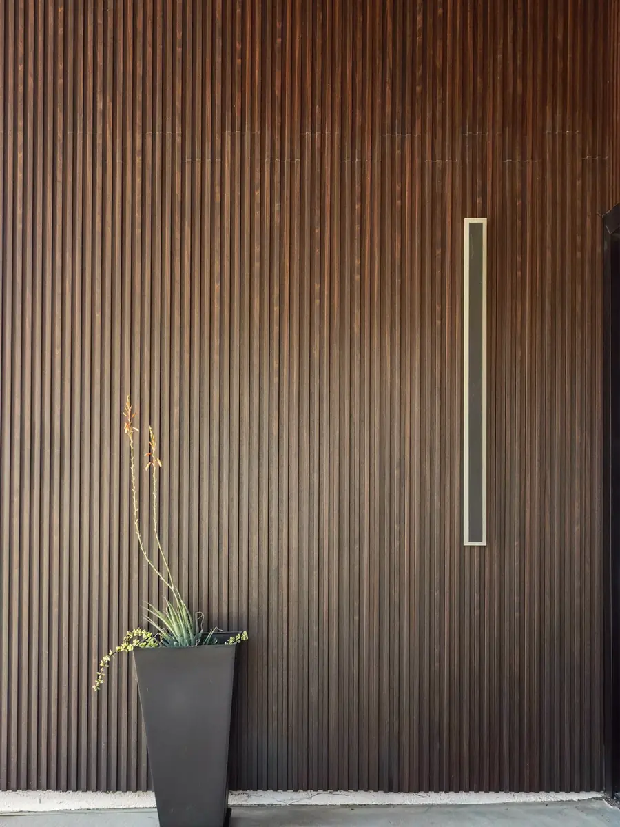 Close detail of the vertical timber slat cladding and recessed lighting on a completed H&A My Design ADU.