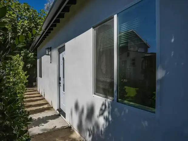 Side elevation of the Sherman Oaks ADU showing windows and the path alongside.