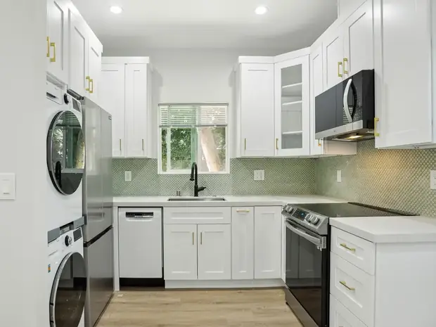 Kitchen inside the Sherman Oaks ADU with a stacked washer and dryer built in.