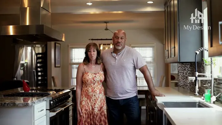 A couple standing together in the kitchen H&A My Design built for them in Long Beach.